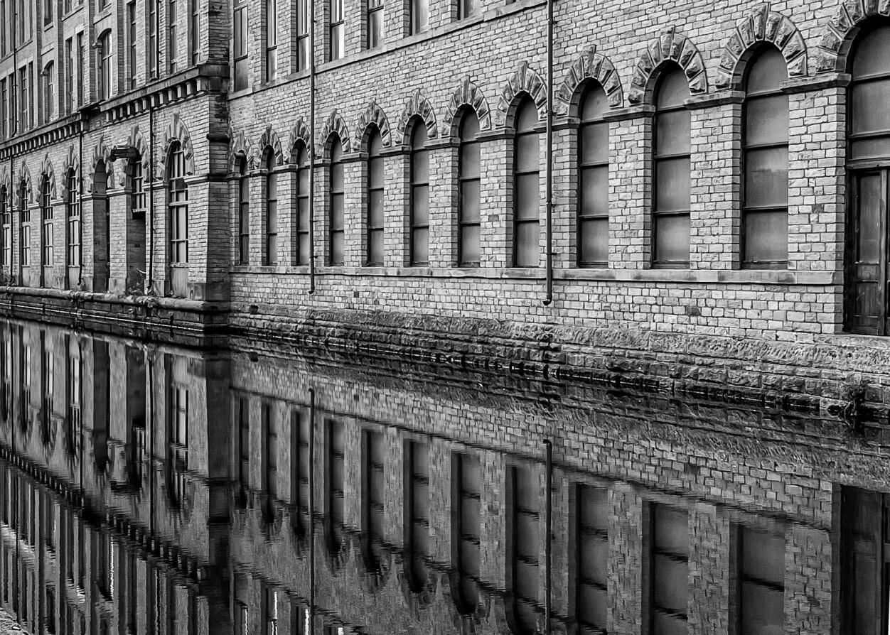 Old Mill reflecting in a river