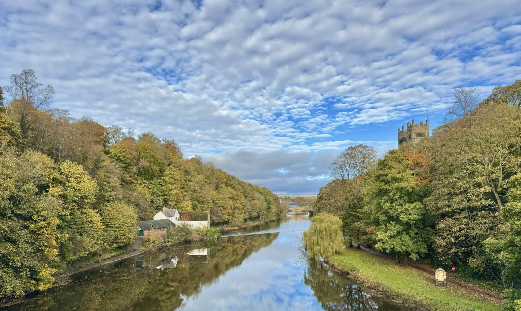 Durham River and blue sky with fluffy clouds